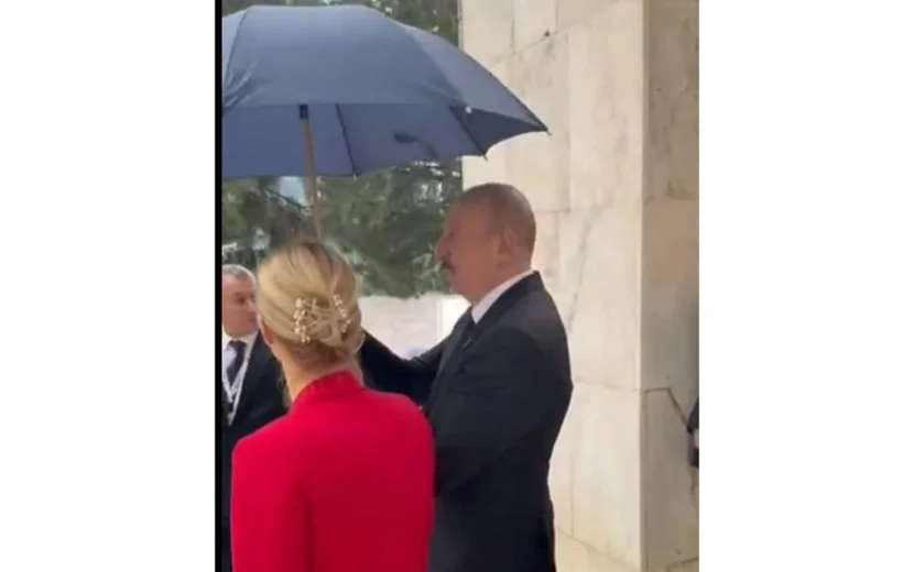 Prezident Kaya Kallasa çətir tutdu - VİDEO